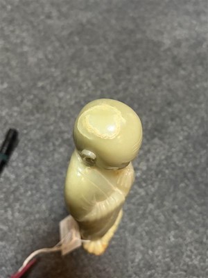 Lot 59 - A Chinese carved jade figure of a Luohan