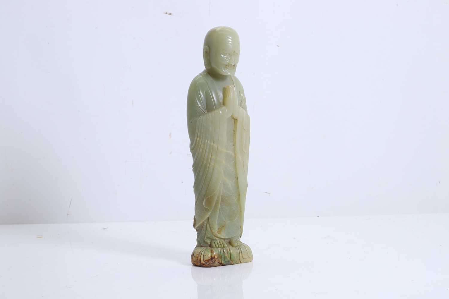 Lot 59 - A Chinese carved jade figure of a Luohan