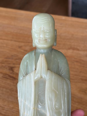 Lot 59 - A Chinese carved jade figure of a Luohan