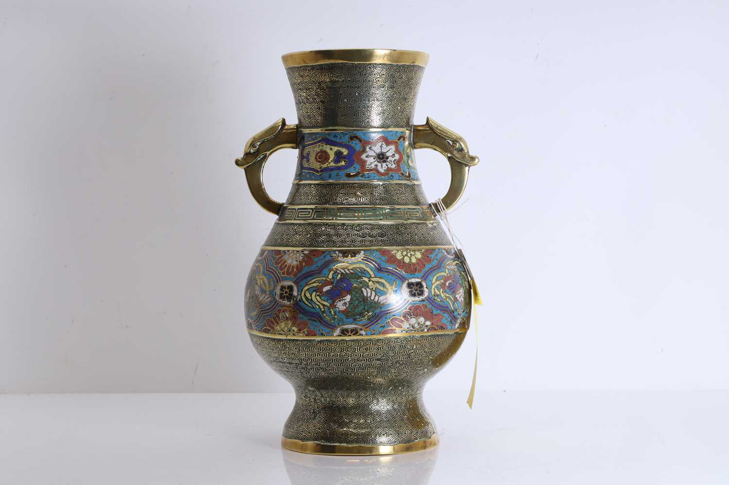 Lot 57 - A champleve brass vase