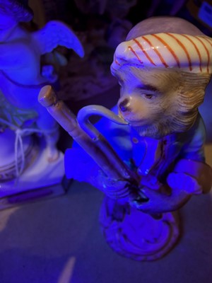 Lot 127 - Two Meissen figures of monkey musicians