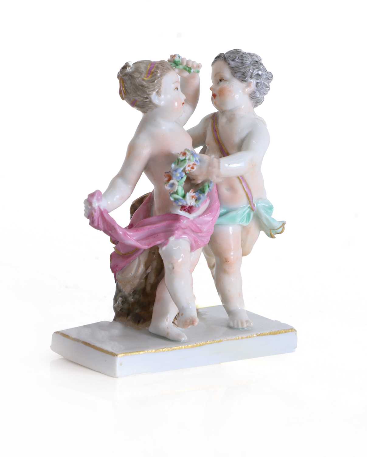 Lot 121 - A Meissen group of two putti with floral garlands