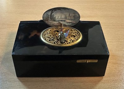 Lot 613 - A tortoiseshell cased singing-bird box