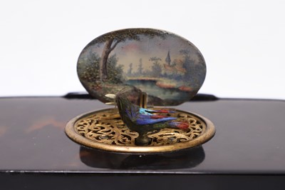 Lot 613 - A tortoiseshell cased singing-bird box