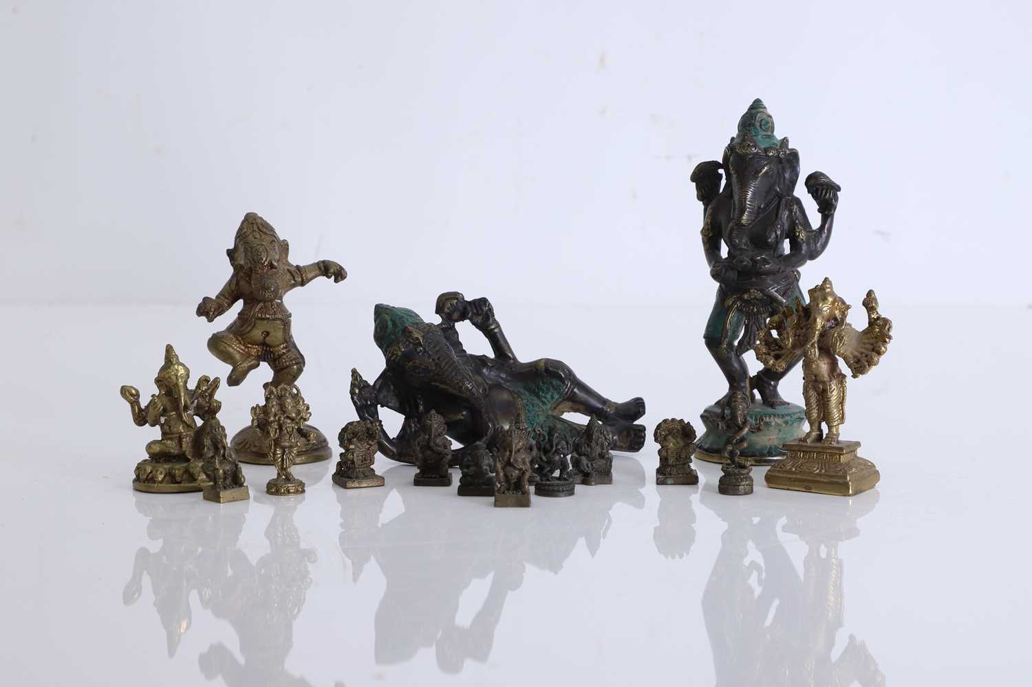 Lot 56 - A collection of miniature brass figures of Ganesh