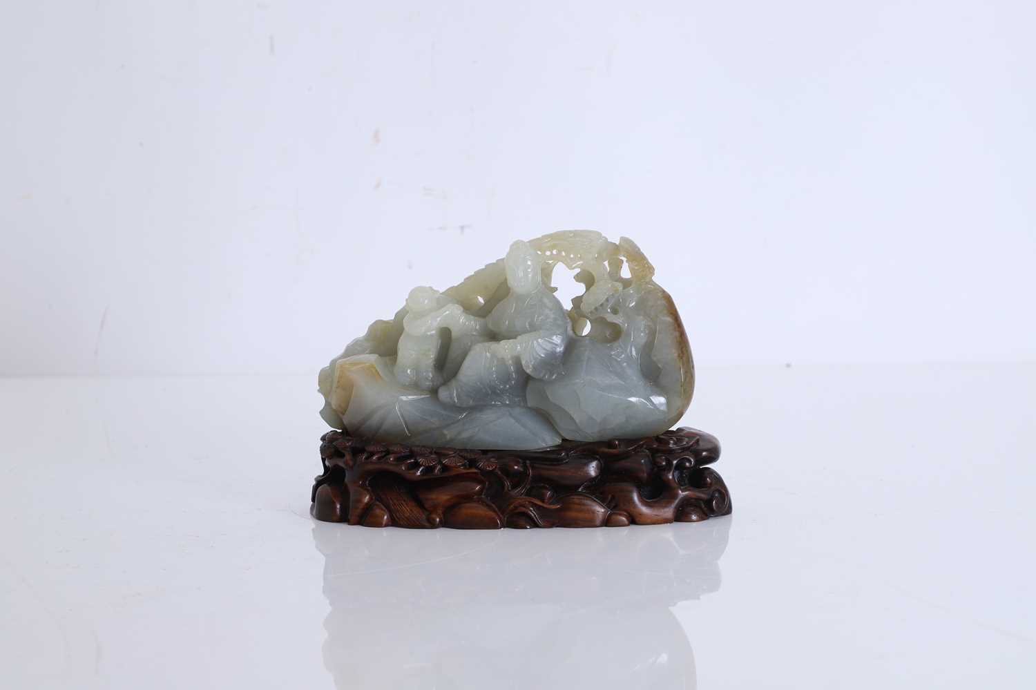 Lot 62 - A carved jade figural group