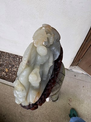 Lot 62 - A carved jade figural group