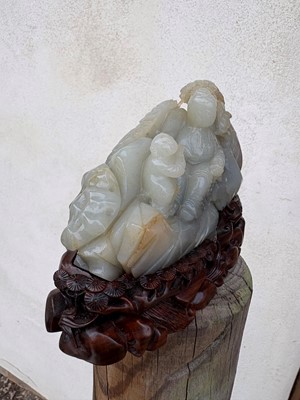 Lot 62 - A carved jade figural group