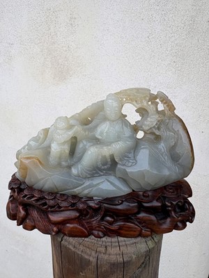 Lot 62 - A carved jade figural group