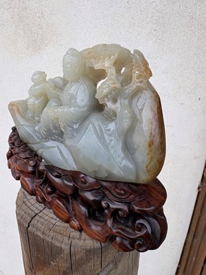 Lot 62 - A carved jade figural group