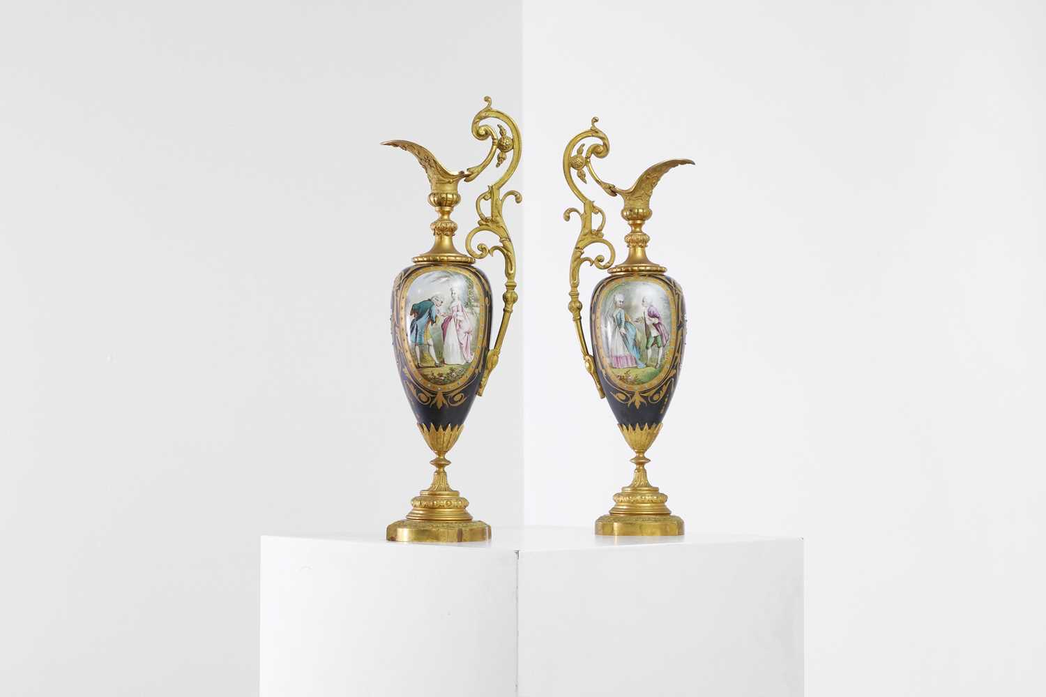 Lot 106 - A pair of ormolu-mounted porcelain ewers