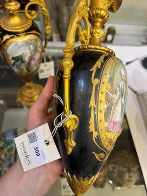 Lot 106 - A pair of ormolu-mounted porcelain ewers