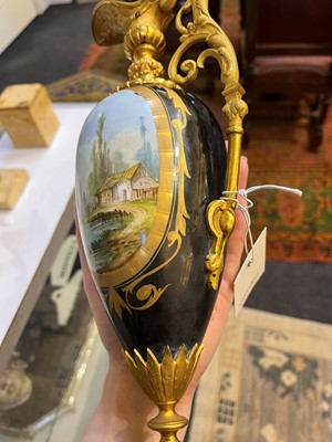 Lot 106 - A pair of ormolu-mounted porcelain ewers
