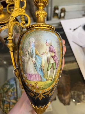 Lot 106 - A pair of ormolu-mounted porcelain ewers
