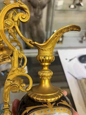 Lot 106 - A pair of ormolu-mounted porcelain ewers