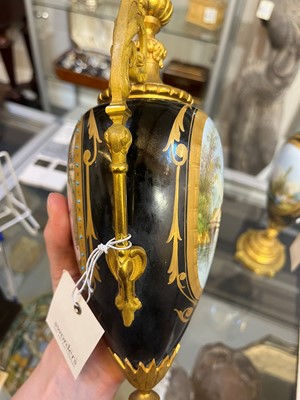 Lot 106 - A pair of ormolu-mounted porcelain ewers