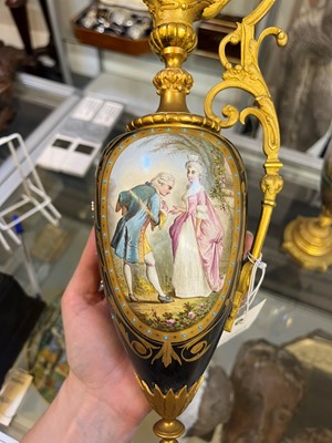 Lot 106 - A pair of ormolu-mounted porcelain ewers