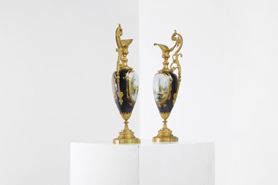 Lot 106 - A pair of ormolu-mounted porcelain ewers
