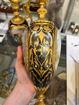 Lot 106 - A pair of ormolu-mounted porcelain ewers