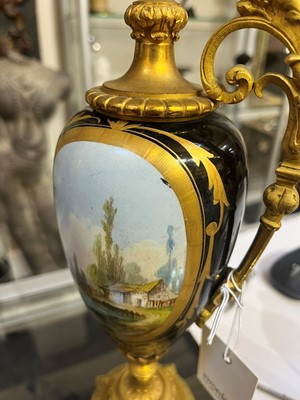 Lot 106 - A pair of ormolu-mounted porcelain ewers