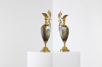Lot 106 - A pair of ormolu-mounted porcelain ewers