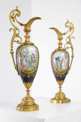 Lot 106 - A pair of ormolu-mounted porcelain ewers