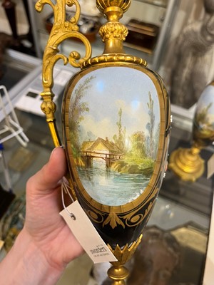 Lot 106 - A pair of ormolu-mounted porcelain ewers