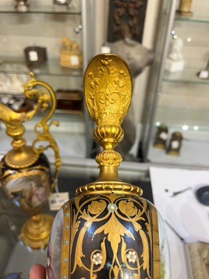 Lot 106 - A pair of ormolu-mounted porcelain ewers