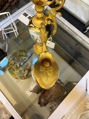 Lot 106 - A pair of ormolu-mounted porcelain ewers