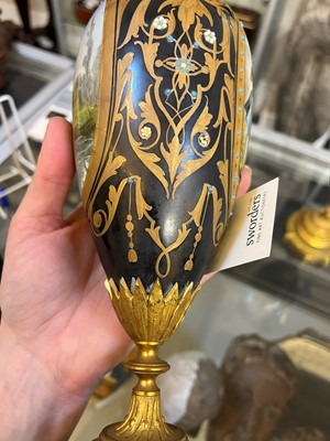 Lot 106 - A pair of ormolu-mounted porcelain ewers