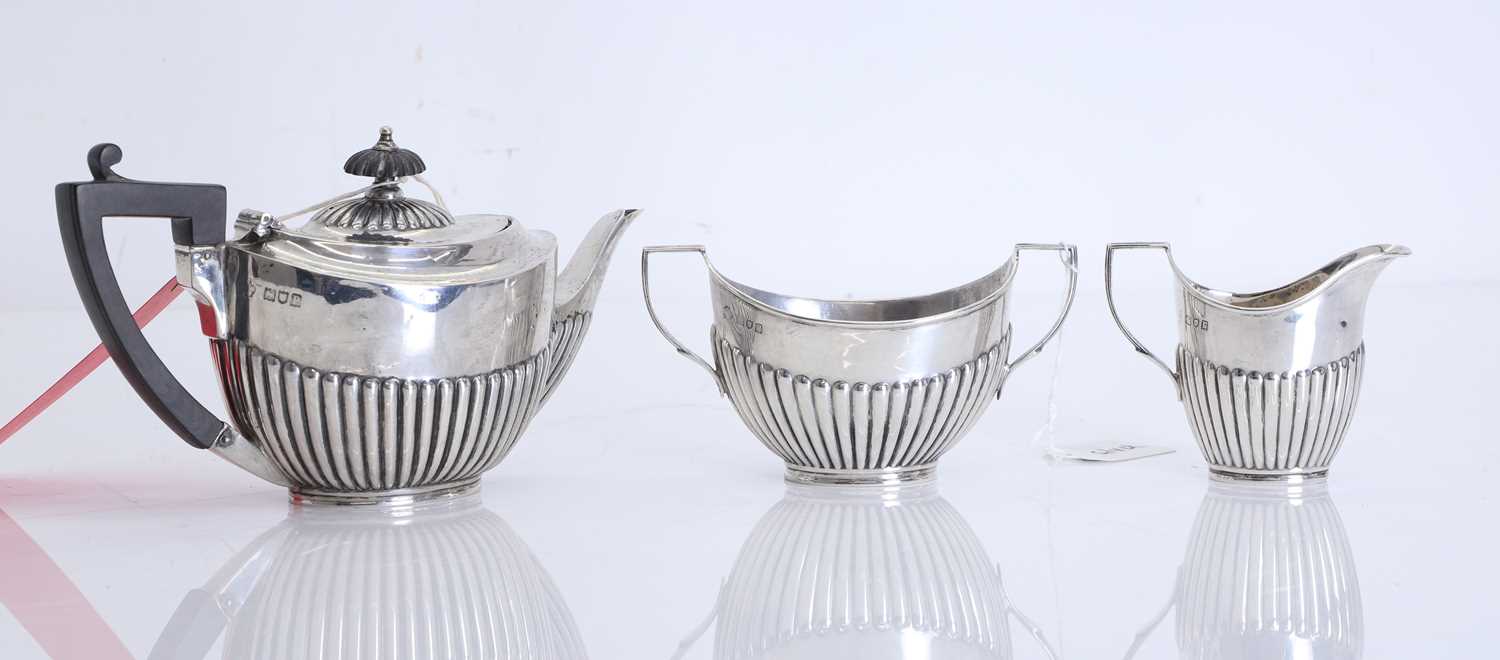 Lot 45 - A three piece silver tea service