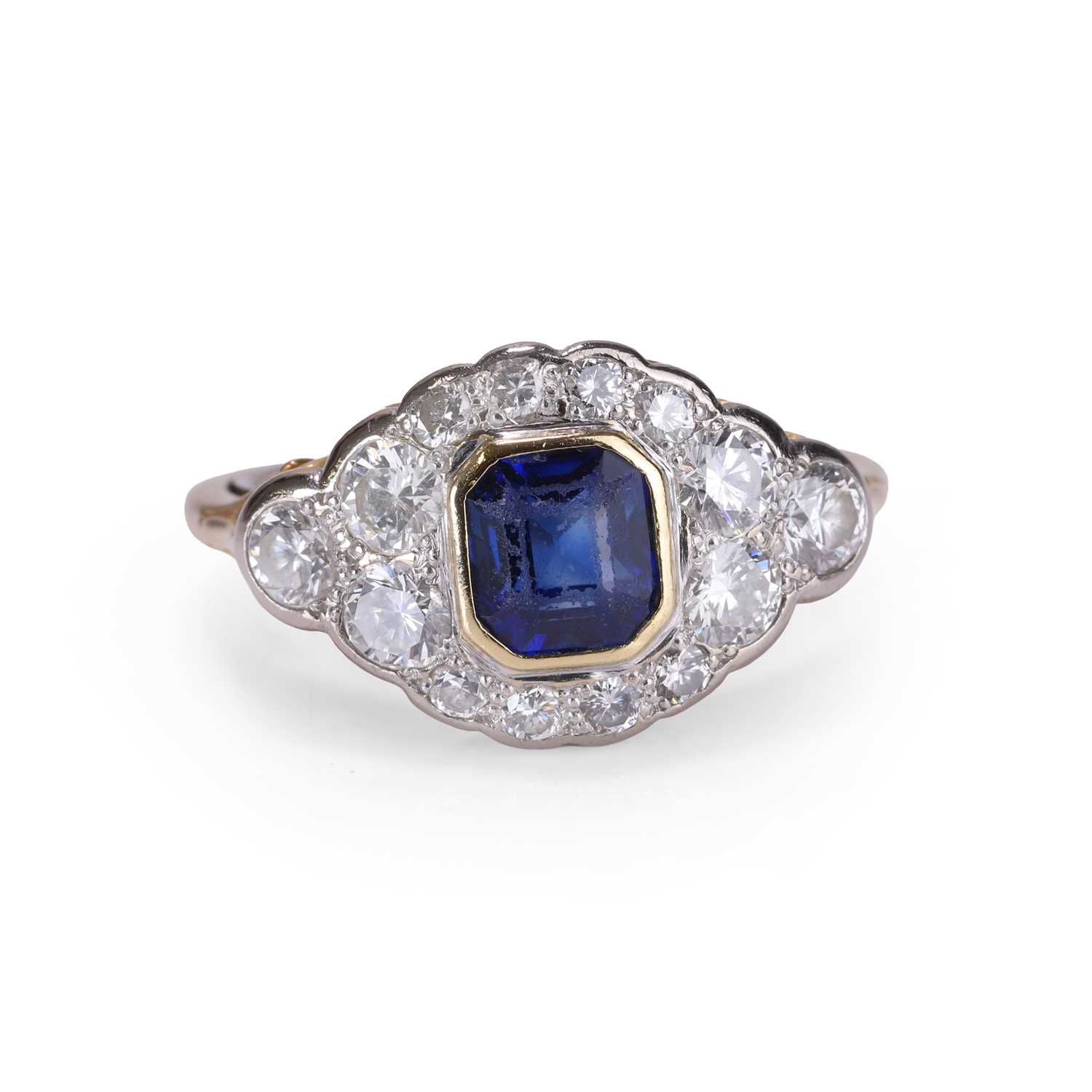 Lot 52 - A sapphire and diamond cluster ring