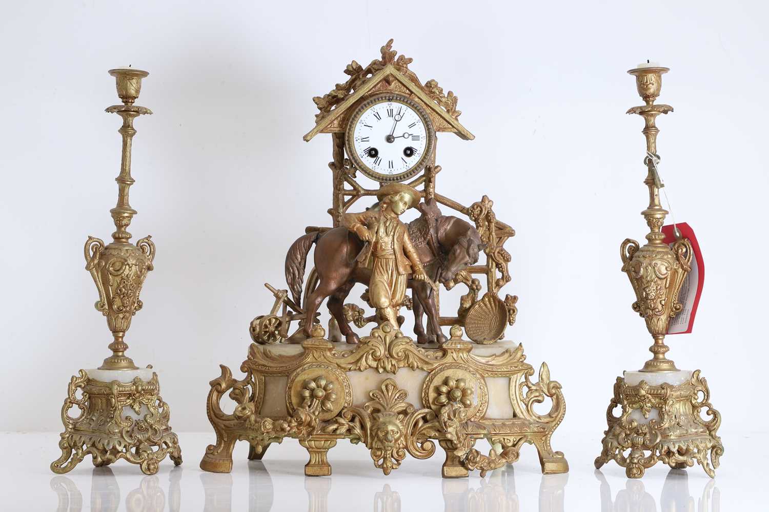 Lot 201 - A French gilt metal and alabaster clock garniture