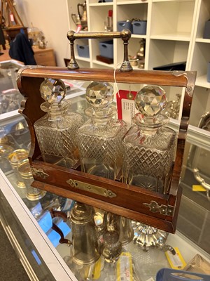 Lot 309 - A Victorian three bottle cut glass tantalus