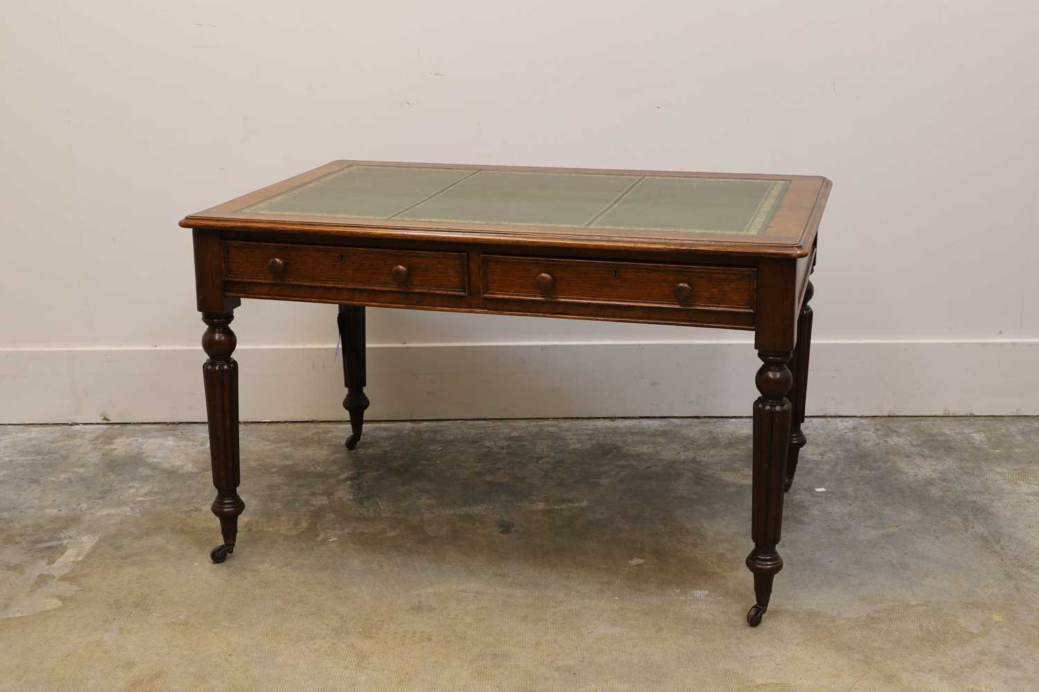 Lot 526 - A Victorian oak writing table
