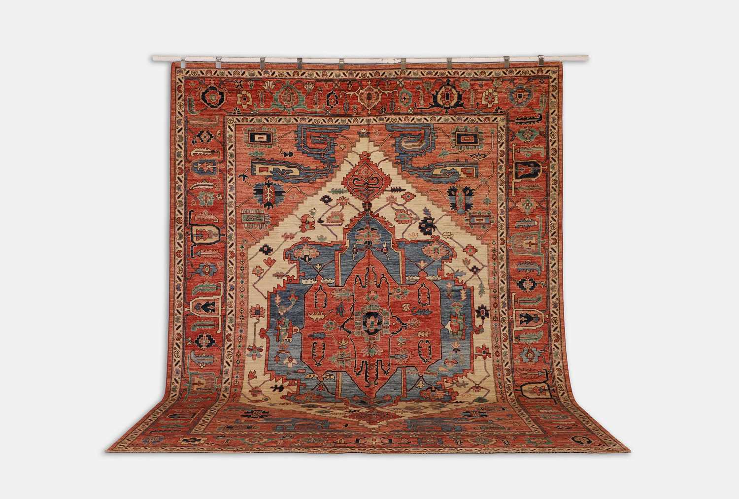 Lot 155 - A wool carpet of antique Persian Heriz design