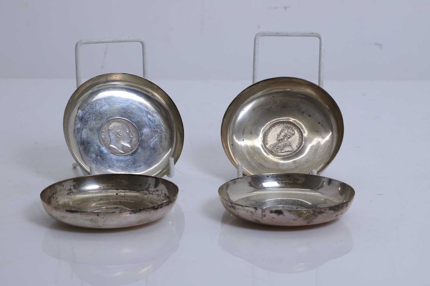 Lot 3 - Four silver one rupee coin inlaid pin dishes