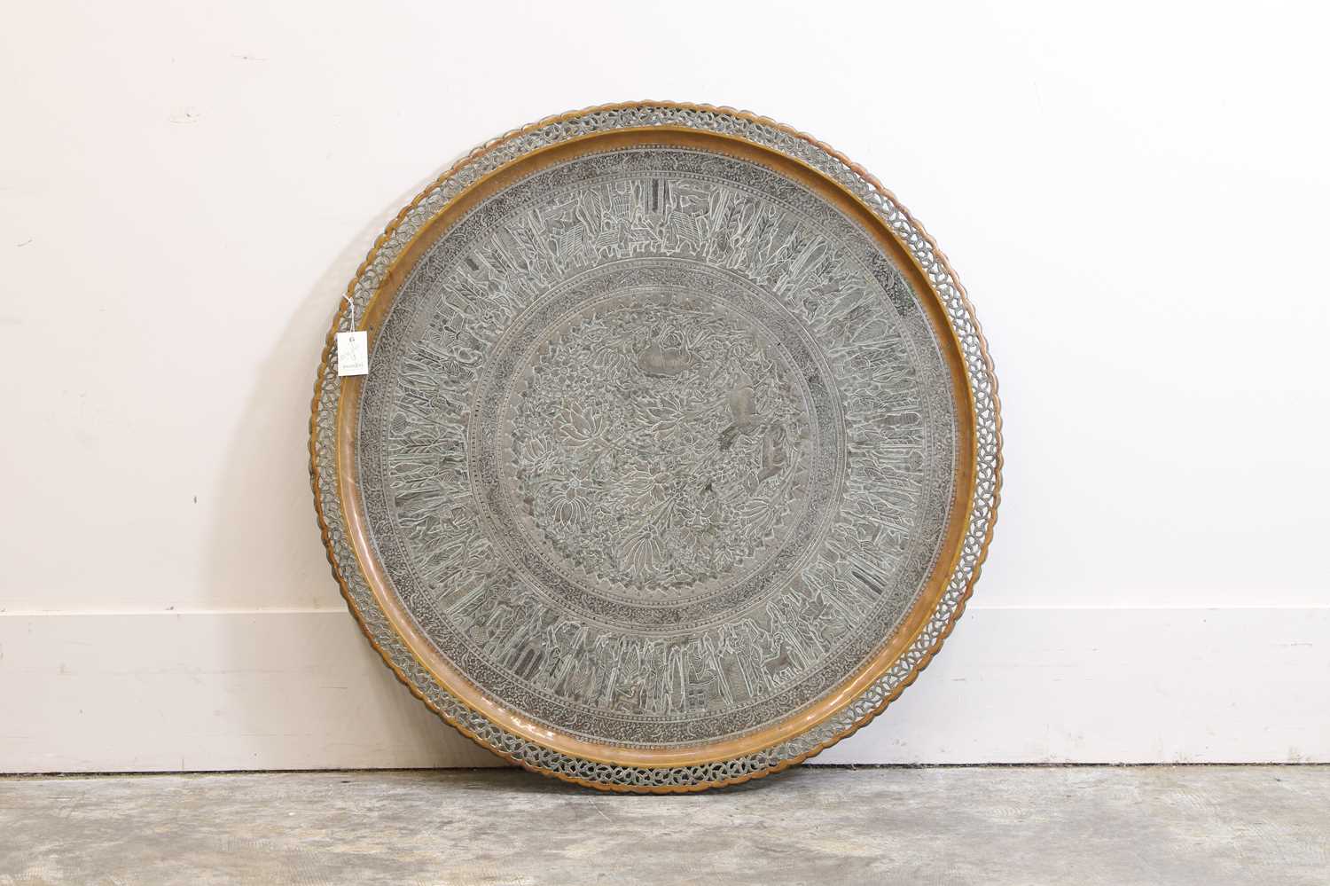 Lot 67 - A large brass charger