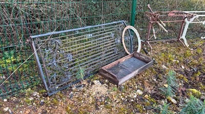 Lot 558 - A collection of garden cast iron items