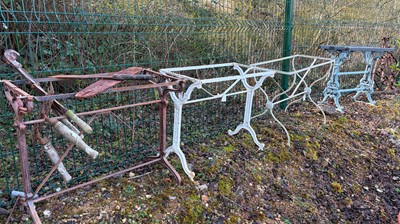 Lot 558 - A collection of garden cast iron items