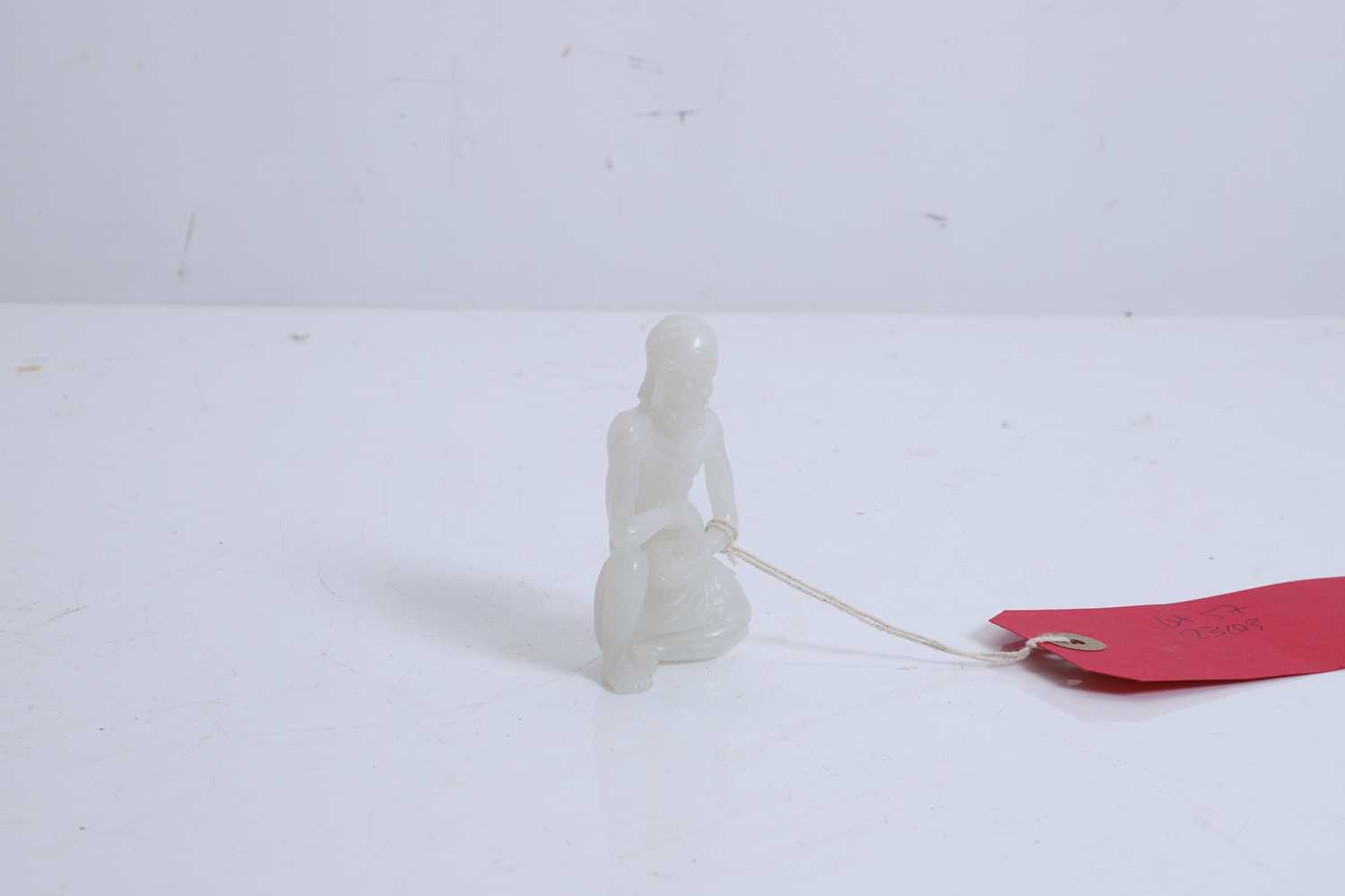 Lot 57 - A small Chinese carved jade figure of an emaciated Luohan