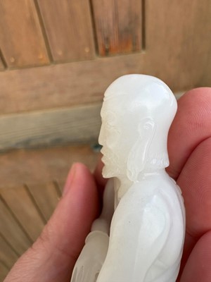 Lot 57 - A small Chinese carved jade figure of an emaciated Luohan
