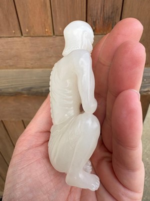 Lot 57 - A small Chinese carved jade figure of an emaciated Luohan