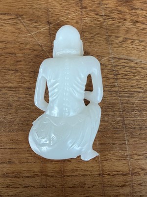 Lot 57 - A small Chinese carved jade figure of an emaciated Luohan