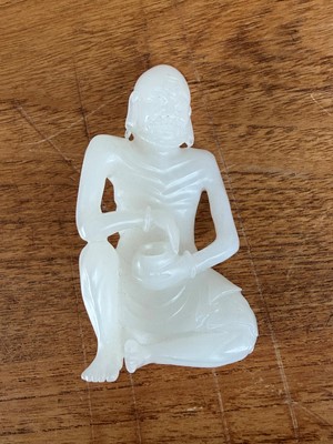 Lot 57 - A small Chinese carved jade figure of an emaciated Luohan