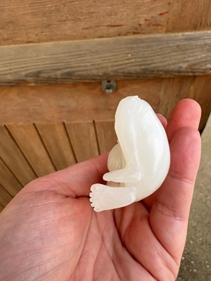Lot 57 - A small Chinese carved jade figure of an emaciated Luohan