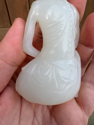 Lot 57 - A small Chinese carved jade figure of an emaciated Luohan