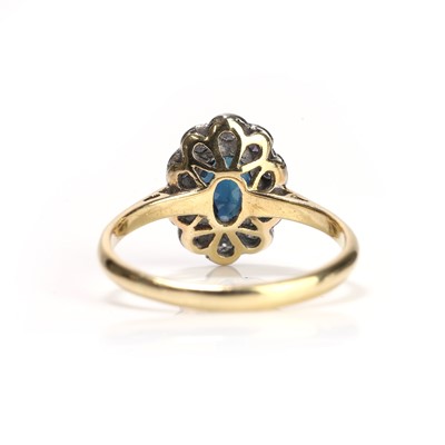 Lot 79 - A sapphire and diamond cluster ring
