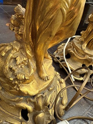 Lot 473 - A pair of gilt metal table lamps