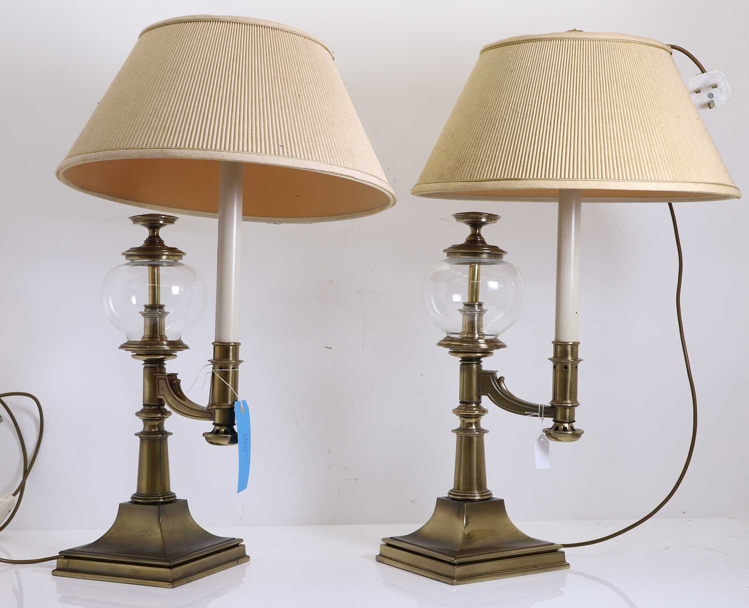 Lot 475 - A pair of brass table lamps